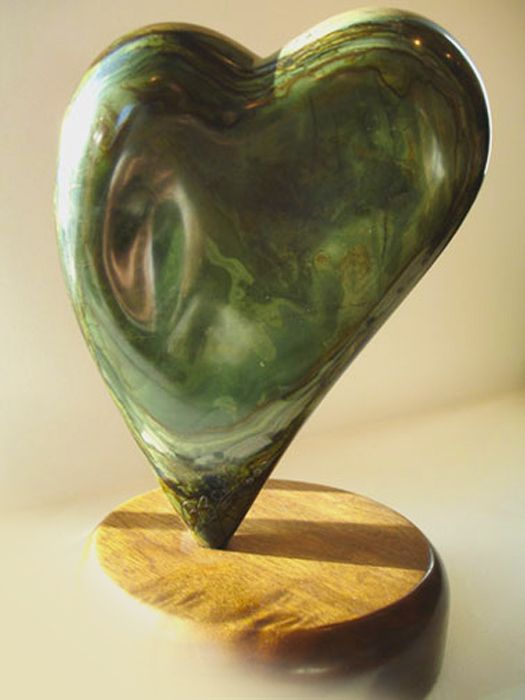 Dolphin Heart Green   10” x 6”  hand-carved New Mexican Serpentine Ricolite on wood base